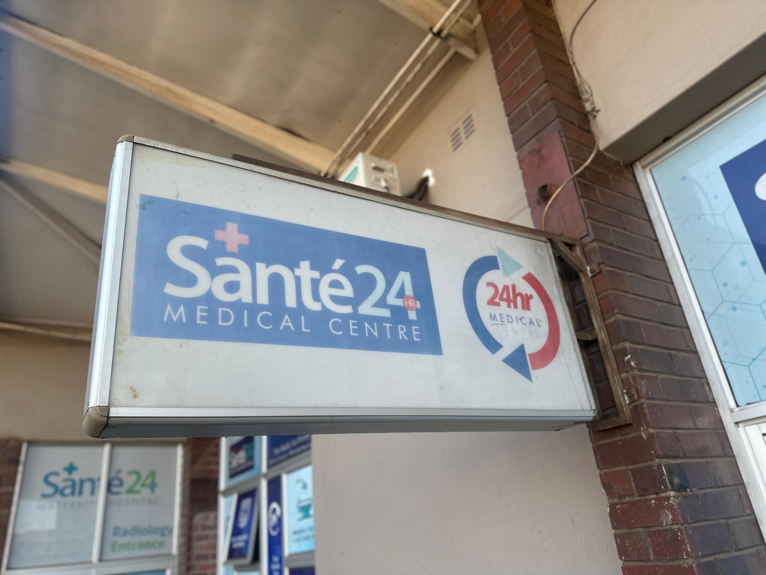 Santé 24 Medical Centre entrance sign with 24hr badge, Harare